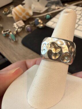 Sterling silver ring features a heavy, hammered nugget texture